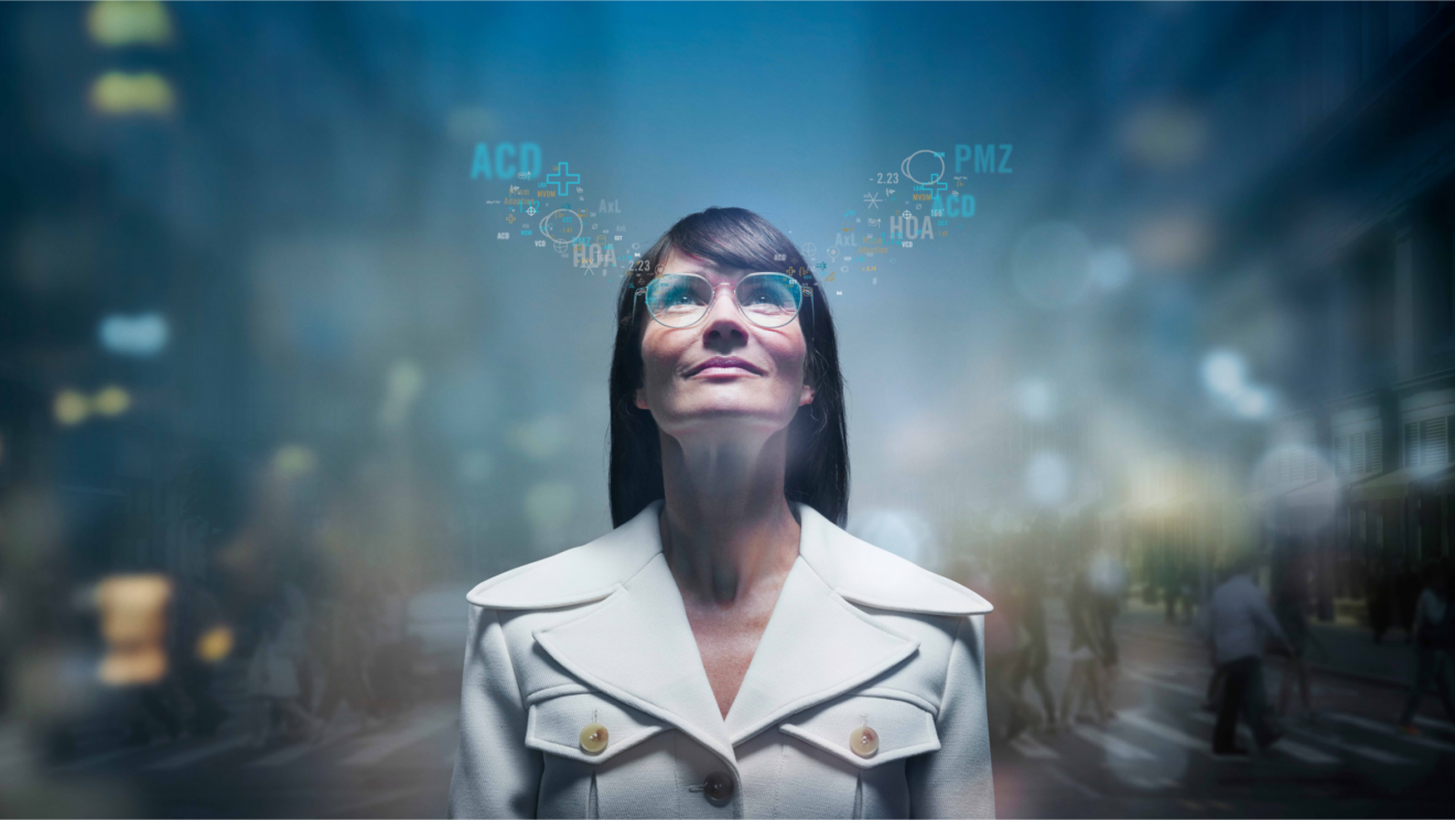 Woman wearing glasses with digital eye measurements overlaid above her lenses.