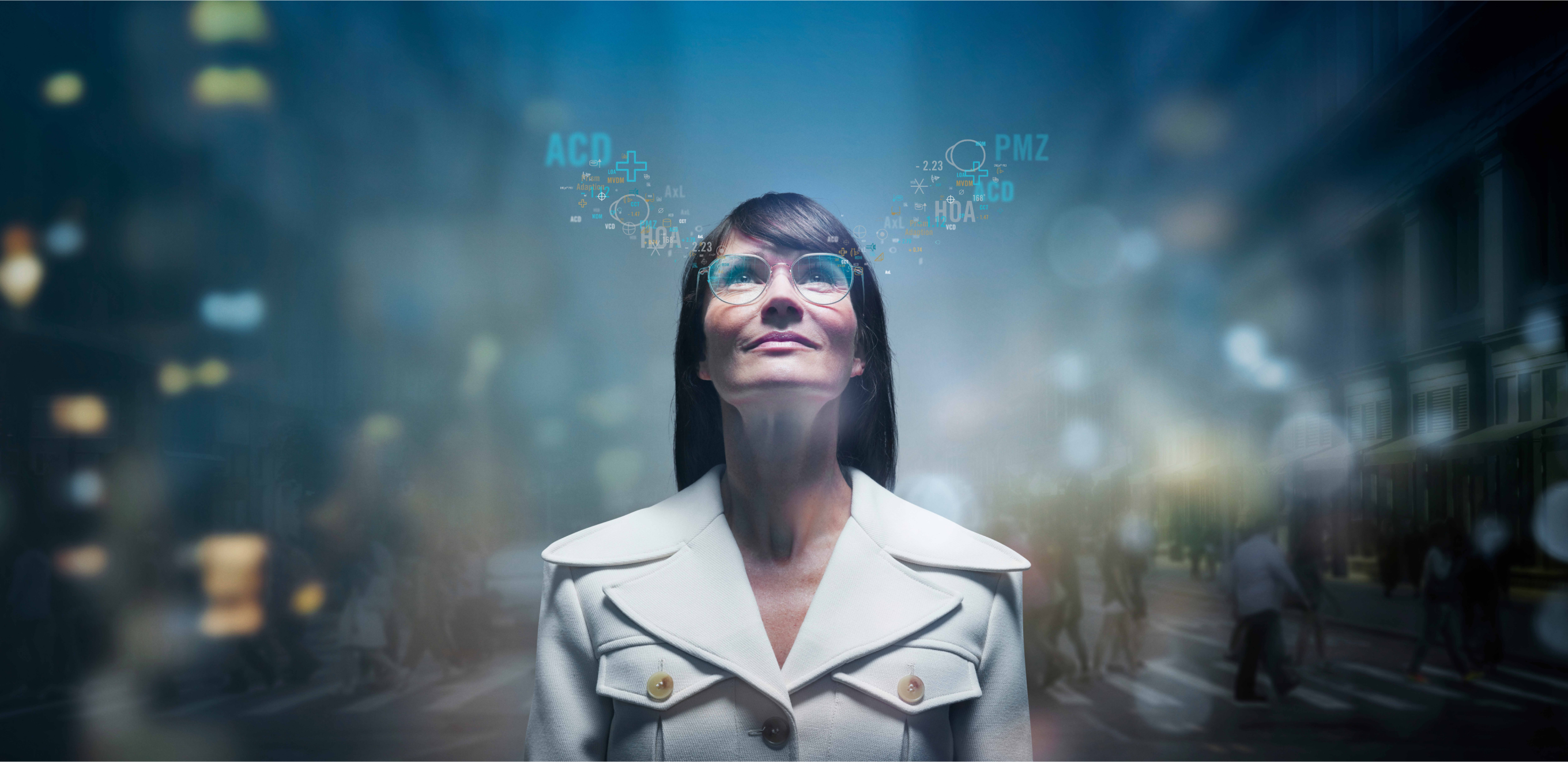 Woman wearing glasses with digital eye measurements overlaid above her lenses.