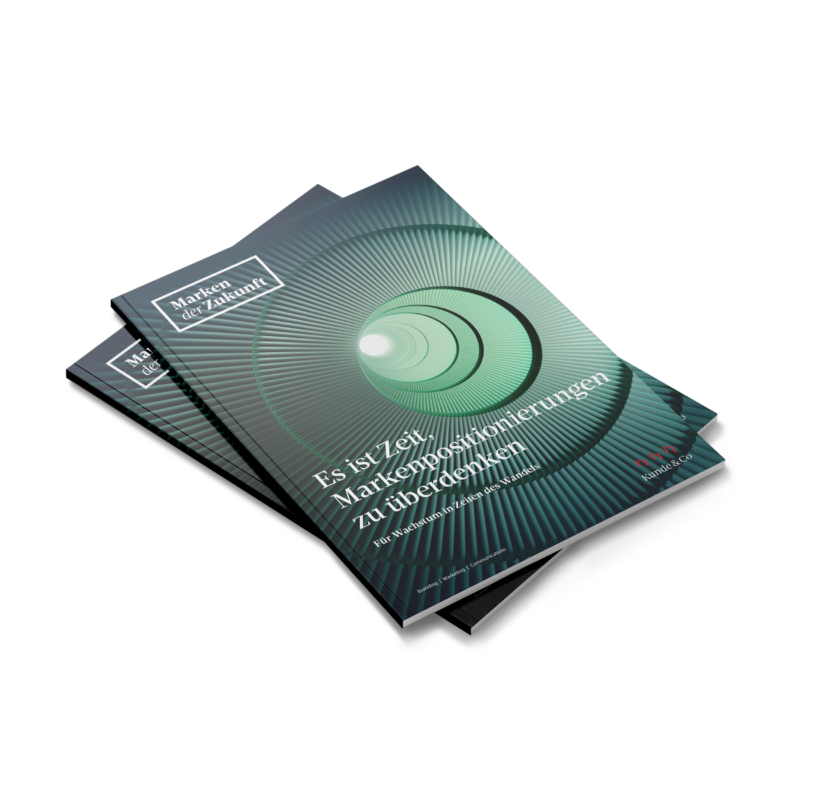Two stacked German “Brands of the Future” brochures featuring a green spiral staircase and a headline about rethinking brand positioning.