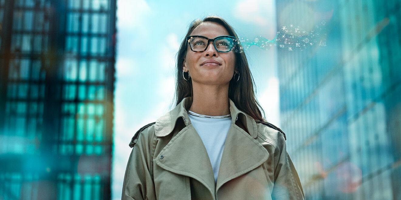 A woman wearing glasses with digital symbols.