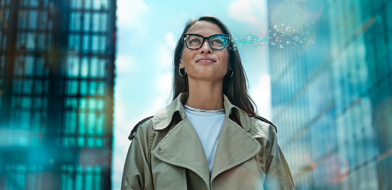 A woman wearing glasses with digital symbols.